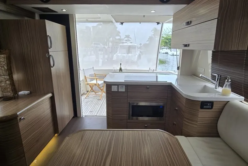 Green Eye Lady Yacht Photos Pics Interior of 2019 Greenline 40 yacht with modern kitchen and outdoor view.