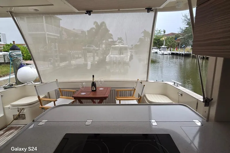 Green Eye Lady Yacht Photos Pics Luxurious 2019 Greenline 40 yacht interior with dining area overlooking serene waterfront.