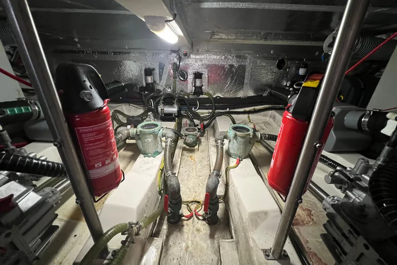 Green Eye Lady Yacht Photos Pics Engine room of 2019 Greenline 40 yacht with fire extinguishers and mechanical components.
