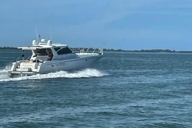  Yacht Photos Pics A 2003 Navigator Californian Veneti yacht cruising on open water under a clear blue sky.