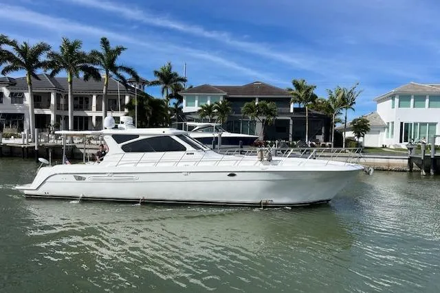  Yacht Photos Pics 2003 Navigator Californian Veneti yacht docked near waterfront homes.