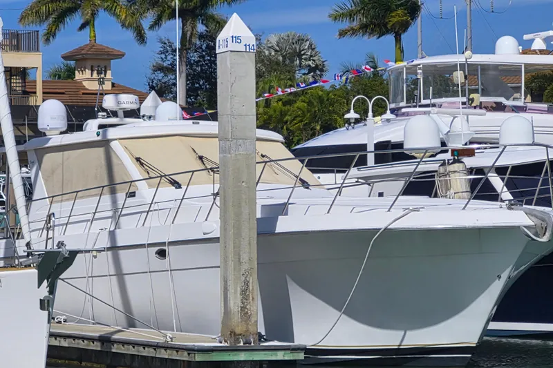  Yacht Photos Pics 2003 Navigator Californian Veneti yacht docked at marina with palm trees in background.