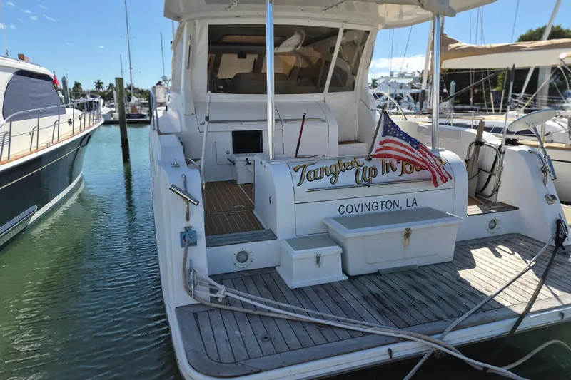  Yacht Photos Pics 2003 Navigator Californian Veneti yacht docked, displaying "Tangled Up In Blue" and American flag.