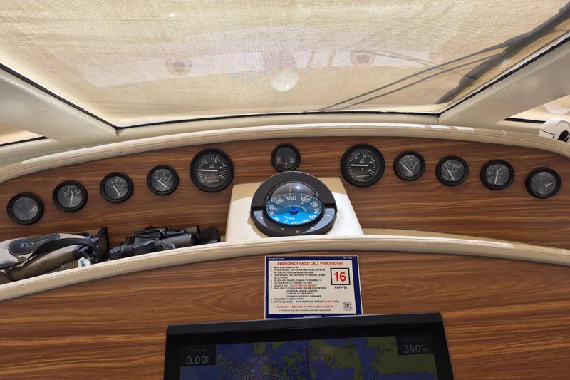  Yacht Photos Pics Dashboard of 2003 Navigator Californian Veneti boat with gauges and navigation screen.