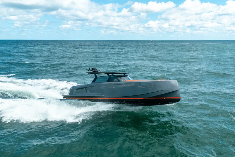 Pharmasea Yacht Photos Pics 2022 Vanquish Yachts VQ45 cruising on open sea under blue sky.