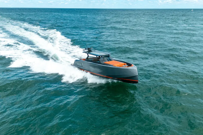 Pharmasea Yacht Photos Pics 2022 Vanquish Yachts VQ45 cruising on open sea, showcasing sleek design and speed.