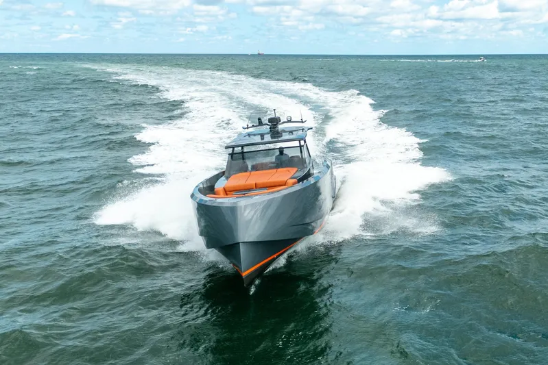 Pharmasea Yacht Photos Pics 2022 Vanquish Yachts VQ45 cruising on open water under a clear sky.