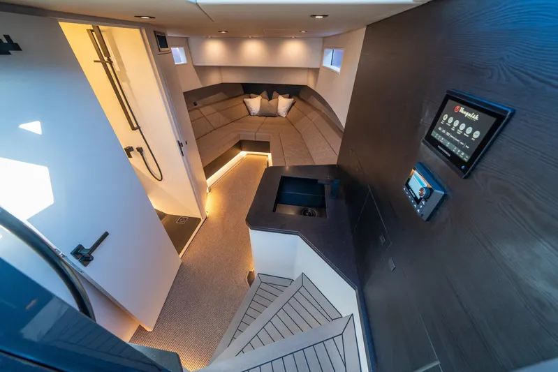 Pharmasea Yacht Photos Pics Luxurious interior of 2022 Vanquish Yachts VQ45 with modern design and ambient lighting.