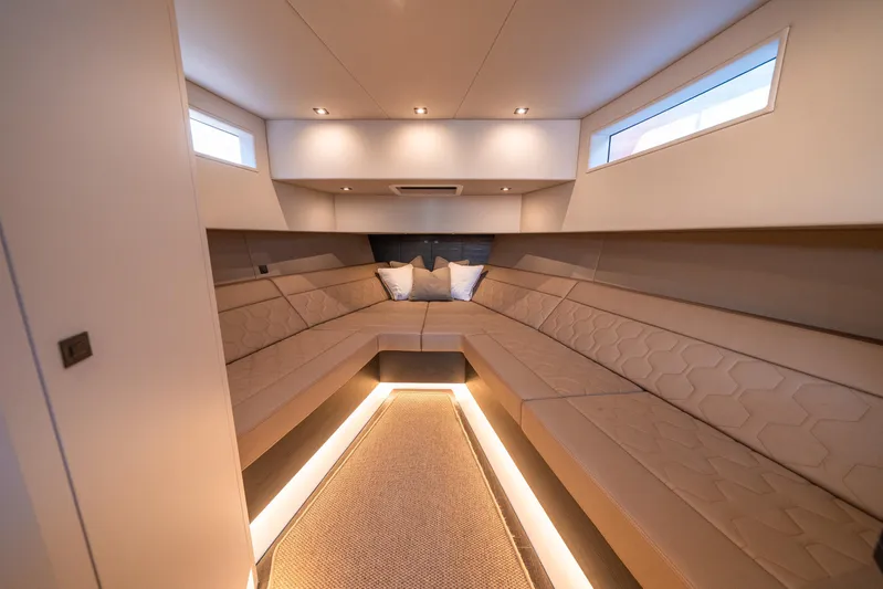 Pharmasea Yacht Photos Pics Luxurious interior of 2022 Vanquish Yachts VQ45 with elegant seating and ambient lighting.
