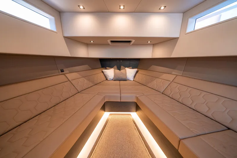 Pharmasea Yacht Photos Pics Luxurious interior of 2022 Vanquish Yachts VQ45 with elegant seating and ambient lighting.