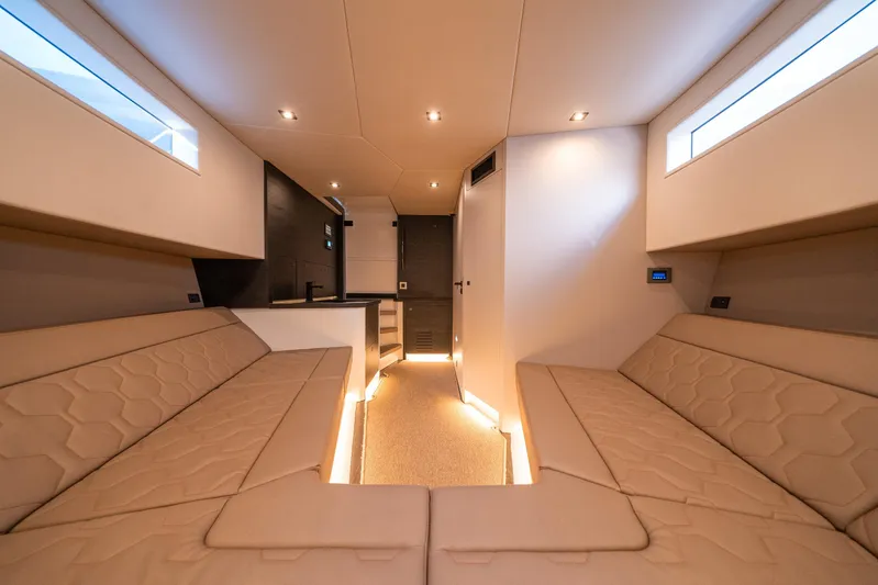 Pharmasea Yacht Photos Pics Luxurious interior of 2022 Vanquish Yachts VQ45 with modern seating and ambient lighting.