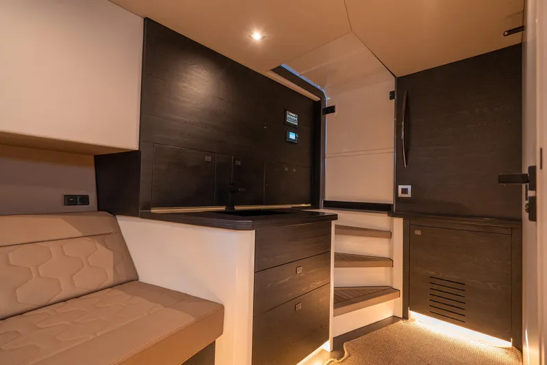 Pharmasea Yacht Photos Pics Luxurious interior of 2022 Vanquish Yachts VQ45, featuring modern design and ambient lighting.