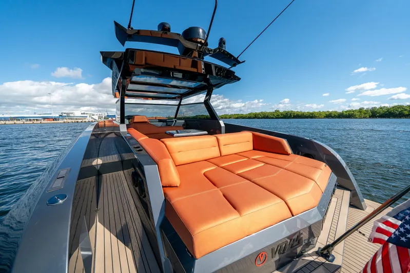 Pharmasea Yacht Photos Pics 2022 Vanquish Yachts VQ45 with orange seating, cruising on a sunny day.