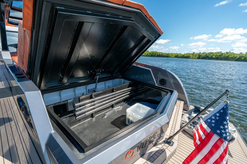Pharmasea Yacht Photos Pics 2022 Vanquish Yachts VQ45 storage compartment open on a sunny day by the water.