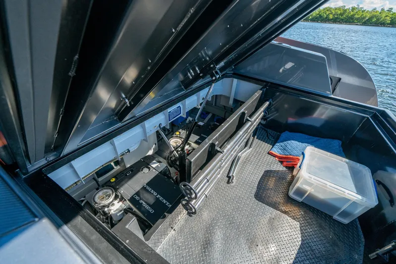 Pharmasea Yacht Photos Pics 2022 Vanquish Yachts VQ45 engine compartment with Volvo Penta engine, open hatch view.