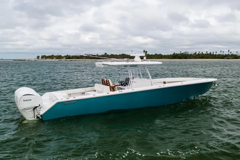  Yacht Photos Pics 2022 Jupiter 38 HFS boat on water with Yamaha engine, cloudy sky backdrop.