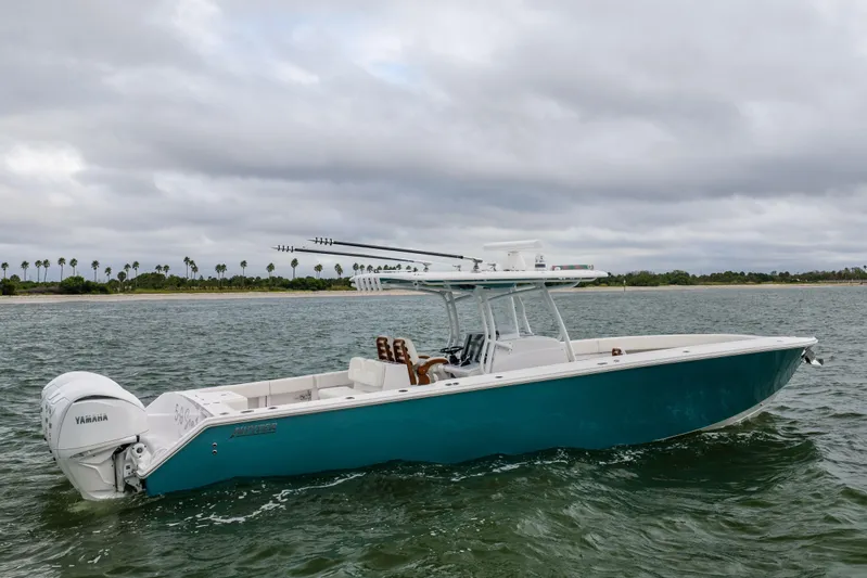  Yacht Photos Pics 2022 Jupiter 38 HFS boat on water with Yamaha engines, cloudy sky backdrop.