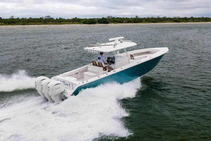  Yacht Photos Pics 2022 Jupiter 38 HFS boat cruising on open water, showcasing powerful engines and sleek design.