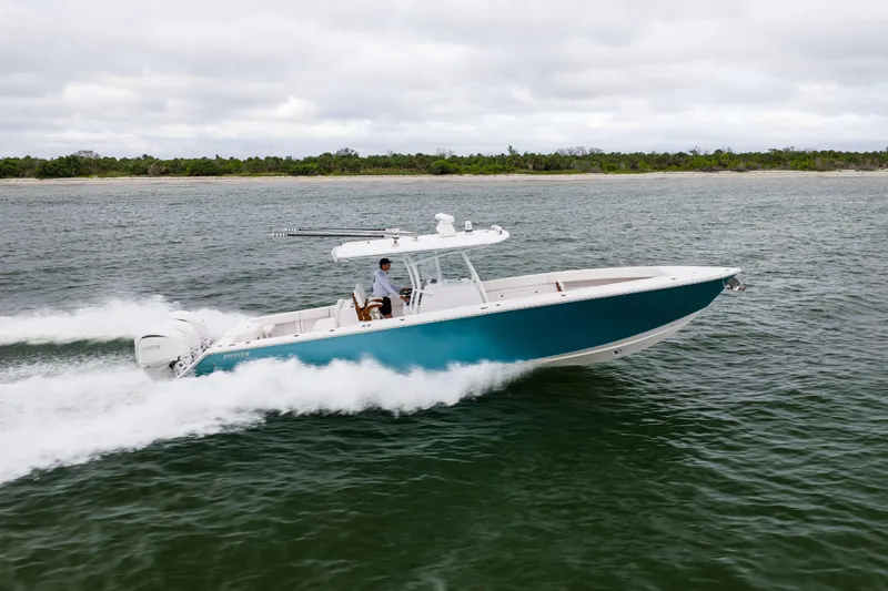  Yacht Photos Pics 2022 Jupiter 38 HFS boat cruising on open water, side view.