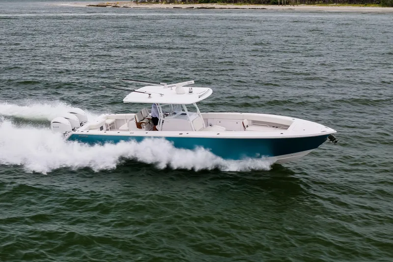  Yacht Photos Pics 2022 Jupiter 38 HFS boat cruising on open water, showcasing sleek design and powerful engines.