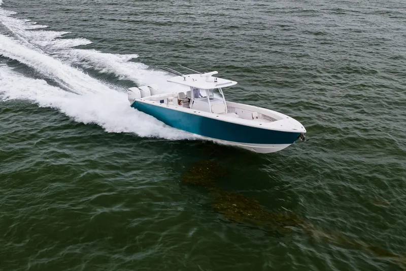  Yacht Photos Pics 2022 Jupiter 38 HFS boat cruising on open water, showcasing sleek design and powerful performance.