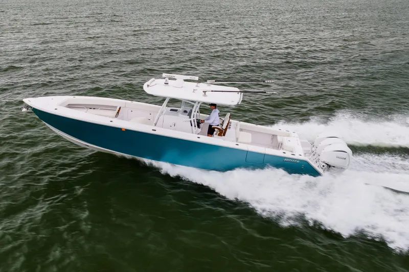  Yacht Photos Pics 2022 Jupiter 38 HFS boat cruising on open water, showcasing sleek design and powerful engines.