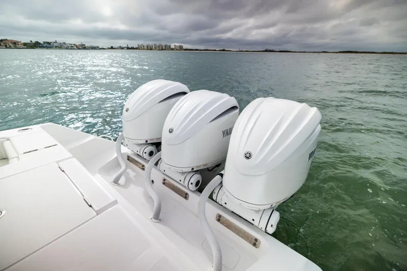  Yacht Photos Pics 2022 Jupiter 38 HFS boat with triple Yamaha outboard engines on water.
