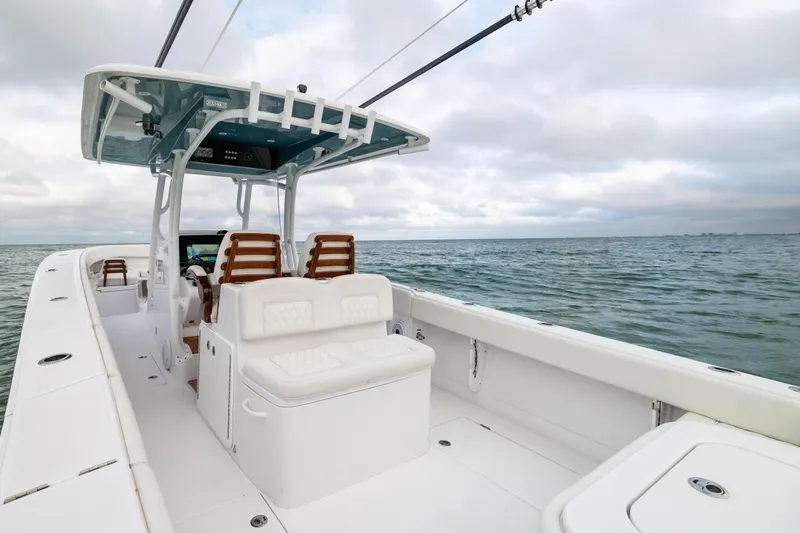 Yacht Photos Pics 2022 Jupiter 38 HFS boat on open water, featuring sleek design and comfortable seating.