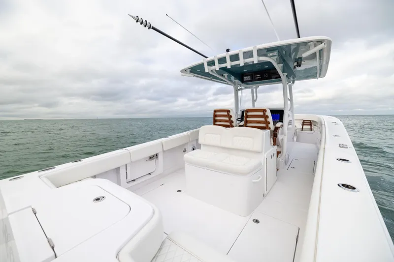  Yacht Photos Pics 2022 Jupiter 38 HFS boat with sleek design on open water under cloudy sky.