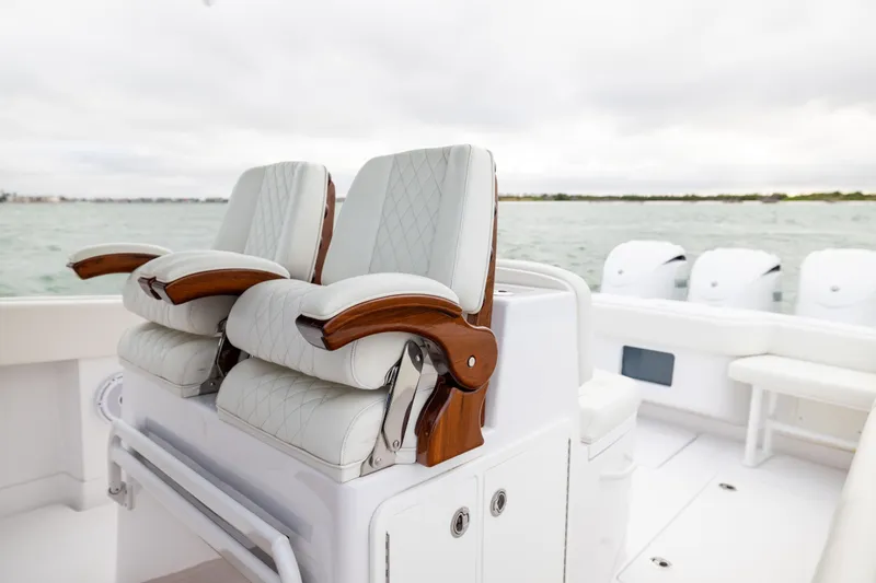  Yacht Photos Pics Luxury seating on 2022 Jupiter 38 HFS boat with ocean backdrop.
