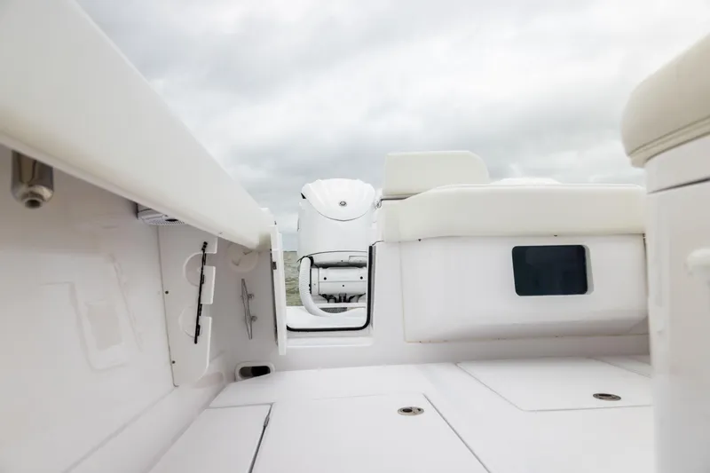  Yacht Photos Pics 2022 Jupiter 38 HFS boat interior with white seating and storage compartments.