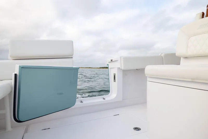  Yacht Photos Pics 2022 Jupiter 38 HFS boat interior with white seating and ocean view.