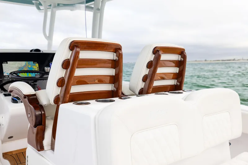  Yacht Photos Pics 2022 Jupiter 38 HFS boat interior with elegant wooden and white leather seating.