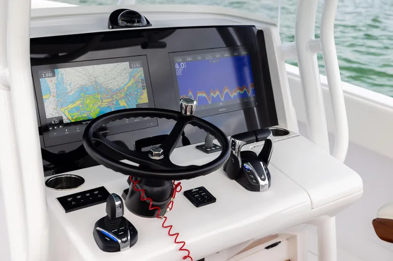  Yacht Photos Pics Helm of 2022 Jupiter 38 HFS boat with advanced navigation displays and controls.