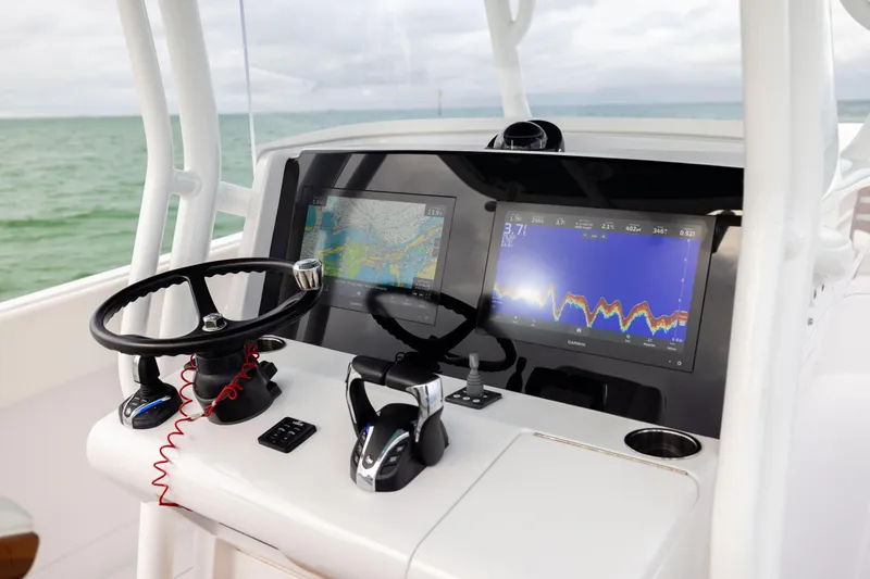  Yacht Photos Pics 2022 Jupiter 38 HFS boat dashboard with dual navigation screens and steering wheel.