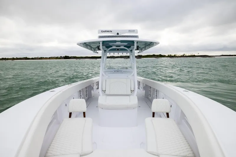  Yacht Photos Pics 2022 Jupiter 38 HFS boat on open water, featuring sleek white seating and modern design.
