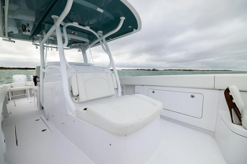  Yacht Photos Pics 2022 Jupiter 38 HFS boat interior with white seating and ocean backdrop.