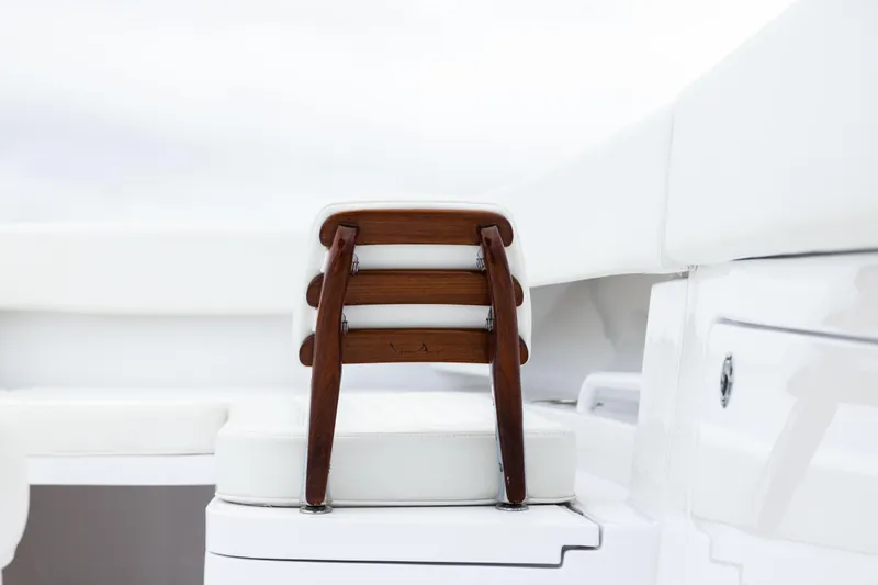  Yacht Photos Pics Wooden seat detail on 2022 Jupiter 38 HFS boat, showcasing luxury design.