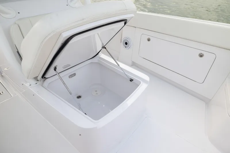  Yacht Photos Pics 2022 Jupiter 38 HFS boat with open storage compartment, white interior.