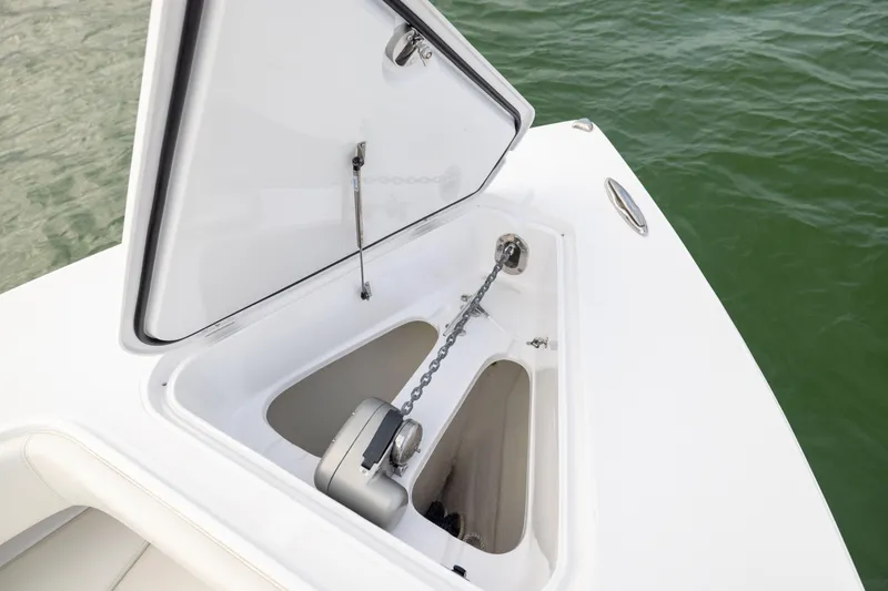  Yacht Photos Pics Open anchor compartment on 2022 Jupiter 38 HFS boat, near green water.