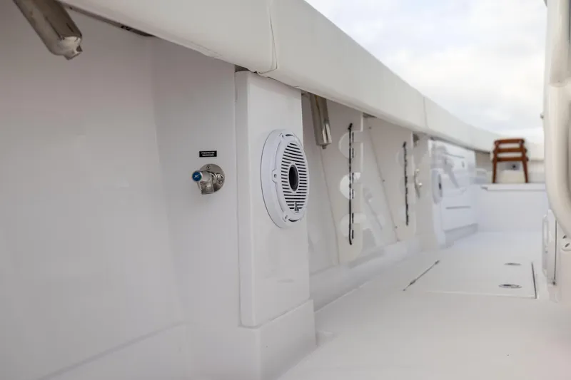  Yacht Photos Pics 2022 Jupiter 38 HFS boat interior with sleek white design and built-in speaker.