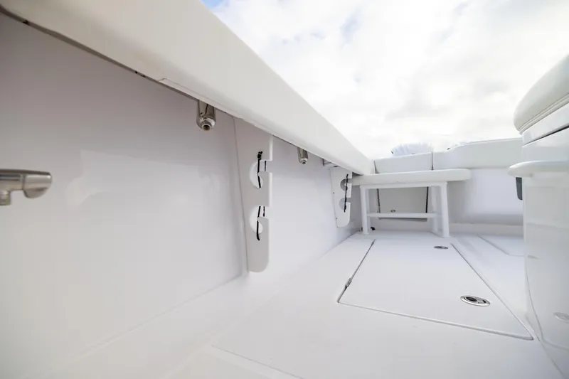  Yacht Photos Pics 2022 Jupiter 38 HFS boat interior with sleek white deck and seating.