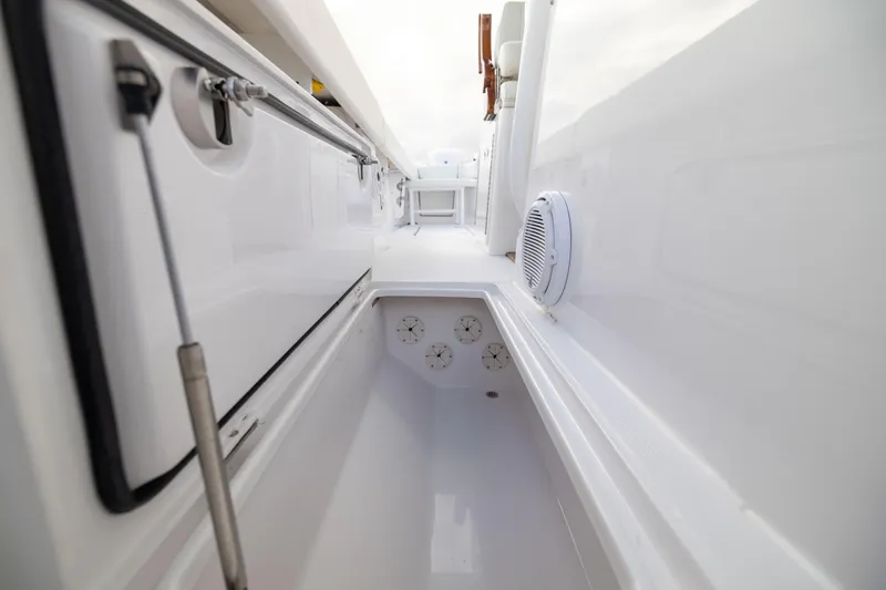  Yacht Photos Pics 2022 Jupiter 38 HFS boat interior, featuring sleek white storage compartments and modern design elements.