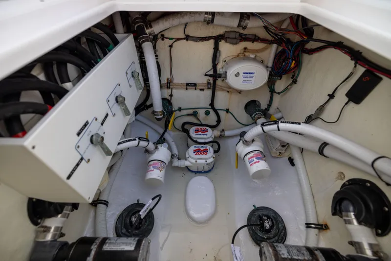  Yacht Photos Pics Engine compartment of 2022 Jupiter 38 HFS boat with wiring and plumbing systems.