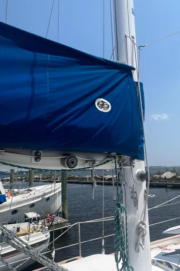 Mariner Yacht Photos Pics 1987 Irwin 38 Mk II sailboat with blue sail cover docked at marina.
