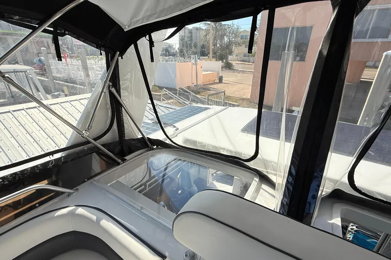 Cole-lateral Damage Yacht Photos Pics Interior view of 1998 Mainship 47 Motor Yacht with clear windows and seating area.