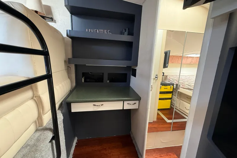 Cole-lateral Damage Yacht Photos Pics Interior of 1998 Mainship 47 Motor Yacht with bunk bed and desk area.