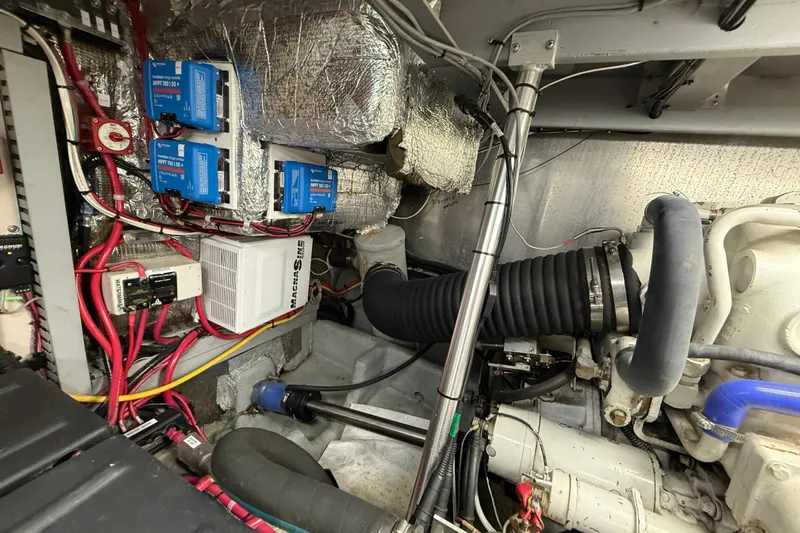 Cole-lateral Damage Yacht Photos Pics Engine room of a 1998 Mainship 47 Motor Yacht with wiring and components.