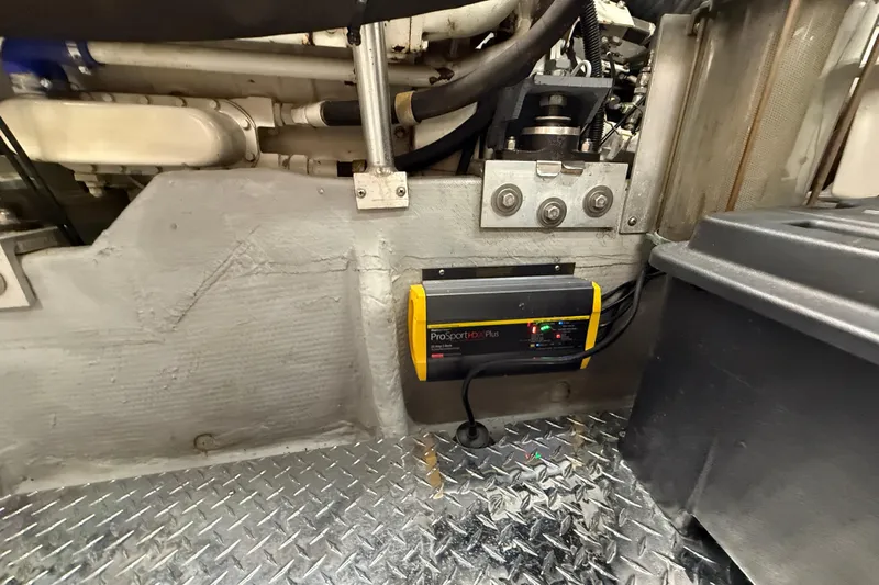 Cole-lateral Damage Yacht Photos Pics Engine room of 1998 Mainship 47 Motor Yacht with ProSportHD Plus charger.