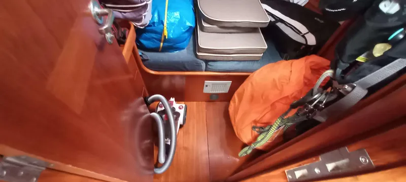 Roxanne Yacht Photos Pics Interior cabin of 1990 Beneteau Oceanis Clipper 500 with storage and equipment.